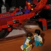 dusty_retro: Snapshot of Lego Monkie Kid set, Red Sun's Inferno Jet, with Red Son in the seat. below it are a Self-fig and arcade dude "JoeLee" being friends. (Repair Hangout)