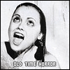 misbegotten: Woman looking upward and screaming on scratchy film stock with text Old Time Horror (Movies Old Time Horror)