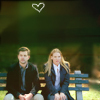 elfin: image: peter and olivia sitting on bench with a heart above them (fringe.p&o bench)