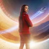 nonelvis: Michael Burnham, a Black woman, wearing a red uniform and standing with her back to the camera, but her face in three-quarters profile. The background is luminescent. (STAR TREK Burnham S5)