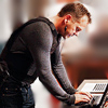 out_of_time: Jack bending over a keyboard, working (Chloe had a day off)