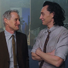 creepy_shetan: cropped screenshot from a bts promo video for Loki s1 of Tom Hiddleston and Owen Wilson sharing a smile (Lokius // shared smiles & knowing looks)