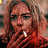 folk_melody: grace le domas covered in blood, smoking a cigarette (c: grace)