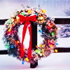 turlough: Christmas wreath hanging on snowy fence ((jul) seasonal colours)