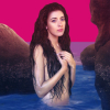monalizard: A picture of Nolwenn Leroy from the "O Filles de l'Eau" album cover, dressed as a mermaid. The background behind her, a cave by the ocean, is edited to have the colors of the bisexual flags. (nolwenn_02)