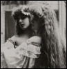 bunnyfemme: black and white photograph of a woman looking into a mirror (1900sphoto)