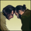 sheafrotherdon: Two men, seated, leaning in to touch their foreheads together (Joe x Nicky (head bonk))