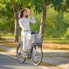 octahedrite: smiling woman on bicycle (cycling)
