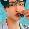 leatherbookmark: seonghwa holding a cherry to his lips on a teal background (seonghwa (cherry))