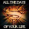 sage: Gold on black superman shield surrounded by the text "All the days of your life" (all the days of your life)