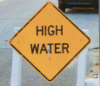 welcometohighwater: photo of a yellow diamond-shaped "high water" sign (high water)