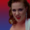 vampiremedia: Sophie Anne Leclerq from True Blood baring her fangs. The background is a gradient with the colors of the bisexual flag (Default)