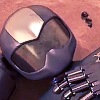 akinoame: TOM 5 from Toonami, looking at an insect on his hand (TOM 5)