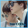 amedia: Two young Chinese men (Da Qing left, Lin Jing right) outside in bright sunlight; Da Qing is wearing gold metal-framed sunglasses, Lin Jing's are horn-rimmed; caption says TOO COOL (Guardian: LJ&DQ too cool)
