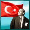 silmaril: A picture of Ataturk with the flying Turkish flag behind him (Turkiye)