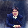 watersword: Brendan Dean, played by Joe Flanigan, from Thoughtcrimes, resting his chin in his palm, looking disgruntled. (Stock: bored now)