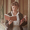 yarnofariadne: evie from the mummy carrying two books in one arm and reading another (film: with all my education)
