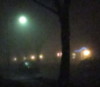 darkanddreary: Blurry photo of a street lamp in a neighborhood. (Rainy Night)