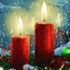 nondenomifan: 2 lit red column candles in holiday night setting (winter candles by casey28)