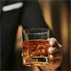 canyonwalker: Man in a suit holding a glass of whiskey (booze)