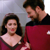 sixbeforelunch: William Riker and Deanna Troi arm-in-arm. No text. (trek - riker and troi the price)
