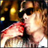 rhoda_rants: Sam Reid as Lestat, sunglasses, open knit white top, sucking blood off his fingers. (lestat)