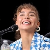 angrybubbles: a picture of Bailey Bass grinning, a light-skinned black actress with green eyes and coily hair, wearing a blue and white suit jacket (excited)