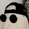 hexcursed: a sheet ghost with circular sunglasses and a backwards baseball hat on (personal)