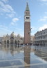 vivdunstan: A view of part of the Piazza San Marco with the tall Campanile beside the Basilica and shiny water-covered ground (venice)