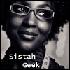 willow: Darkskinned smiling woman, with glasses (Sistah Geek)