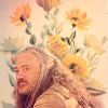 magnavox_23: Ed wearing regular clothes with flowers behind him (OFMD_Ed_beingaregulardude)