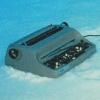lowfidelity: a typewriter lying in the snow (typewriter)