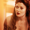 likealighthouse: belle from once upon a time in her iconic yellow dress, eyebrow slightly raised as she focuses. (ouat belle)