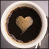 elaineofshalott: A cup of black coffee, its crema making a heart shape on its surface (coffee heart)