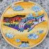 naye: "There's no LGB without the T" embroidered over a pride flag colored hand grasping a trans flag colored one. (no lgb without the t)