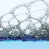 toxicspiderman: A photo of bubbles on top of a blue liquid. (foam if you want to)