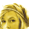 murklins: photo of greta salpeter, sunlit and golden. cropped just above lips to highlight an arched brow and her pearl headband. (so lovely)