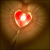 revolutions: A heart-shaped candle seen from above. (heart candle)