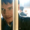 cptjackharkness: (Smirk behind bars)