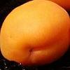 redbird: closeup photo of an apricot (food)