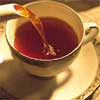 redbird: tea being poured into a cup (cup of tea)