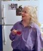 redbird: Me with a cup of tea, standing in front of a refrigerator (drinking tea in jo's kitchen)