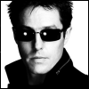 lannamichaels: A black and white image of Hugh Grant in sunglasses and a trenchcoat, looking like something from the Matrix. (hugh is cooler than neo, hugh matrix)
