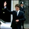 lannamichaels: Hugh Grant waves with his right hand, from Love Actually. (wave)