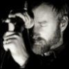 quadruplify: Matt Berninger (lead singer of The National) with forehead on microphone, eyes closed ([Music] The National - microphone)