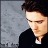 watersword: Image of Orlando Bloom, unsmiling and gazing downwards, and the words "bad day" (Stock: bad day)