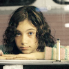 halfwitch: little girl, hands and chin on a table, looking expectant (Teach me)