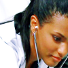 technocracygirl: Martha Jones in a lab coat, leaning over with a stethoscope (medicine)
