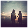 dysis: girls holding hands in front of sunset (holding hands)