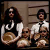 copracat: Students from St Trinians on the balcony with their hats off showing respect for Mr Darcy's funeral (st trinians funeral)